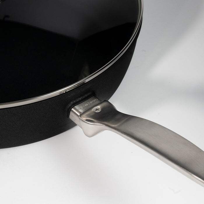 Black pan with a stainless steel handle