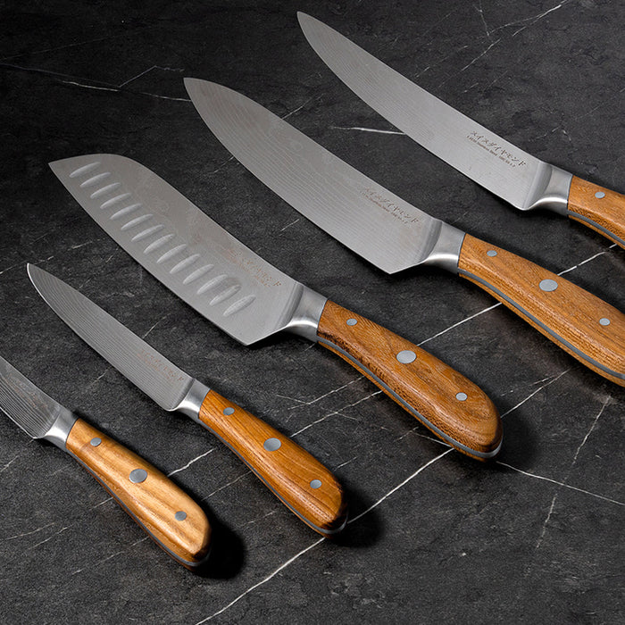 Knives laid out side by side on counter top