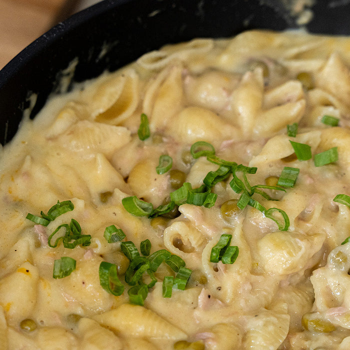 Tuna helper in a swiss diamond pot topped with green onion