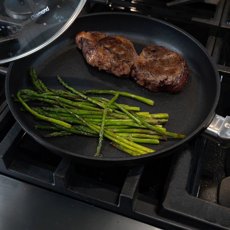 CHD Nonstick 11" Fry Pan with glass lid on gas stove top with food inside
