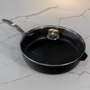 CHD Nonstick 5.8 qt Saute Pan with glass lid on white kitchen marble counter