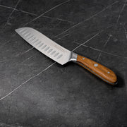 7" Damascus Santoku Knife angled view on black marble kitchen counter