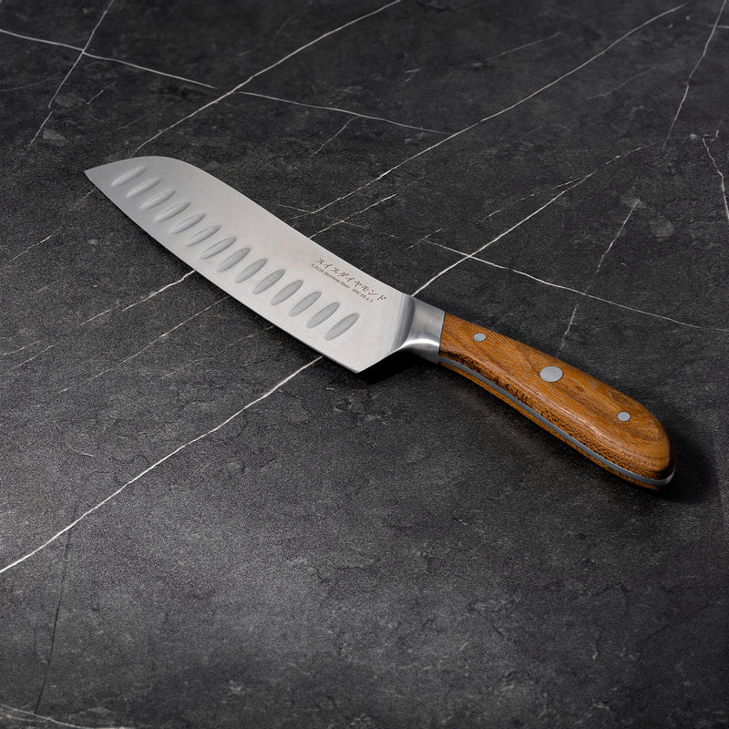 7" Damascus Santoku Knife angled view on black marble kitchen counter