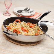 Nonstick Clad Saute Pan with Glass Lid - Induction in use on wooden table