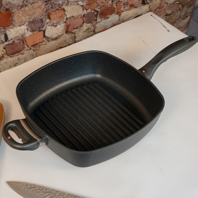 XD Nonstick 11" x 11" Deep Square Grill Pan in use on marble counter top